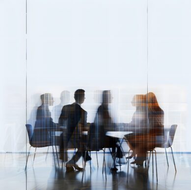 blurred-motion-people-corporate-office-setting-glass-isolated-white-background