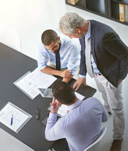 Business men, documents and tablet for workshop, training and mentorship with discussion planning. Presentation, meeting and collaboration for growth, future and investment for company and work goals.